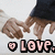 Pixelated image of a person with light brown hair lying on their back, wearing dark clothing and white shoes, with 'LOVE.' text below.
