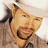 A 48x48 pixel buddy icon featuring a person wearing a white cap and light-colored shirt with the text "toby keith" in bold black letters on the right side.