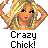 Pixelated image of a blonde woman with hands behind her head, wearing a white necklace and orange top against gray background.