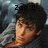 Pixelated image of a person with dark hair and light skin wearing a gray shirt, with 'Zoc !!' text above the head against a blurred background.