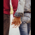 Pixelated image of two people holding hands with pink text 'Hold My Hand Never Let Go' and a solid pink heart on black background.