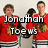 Four identical figures in red hockey jerseys with black and green accents stand side-by-side, each holding a hockey stick.