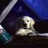 Pixelated image with yellow, blue, gray, and dark sections showing text and a small icon on a yellow background.
