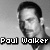 Black-and-white pixelated image of a man with short dark hair, showing text overlays across four