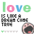 Pixelated 'love' text in green, pink, blue, and light green above black block letters reading 'IS LIKE A DREAM COME TRUE', with a yawning cartoon face and colored hearts below.