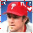 A pixelated image of a person wearing a red cap with white 'P' logo, gray jacket, and red collar against blue background.