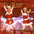 Two figures in red and white attire dance against a pixelated brown background with light effects.