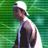 Pixelated static image of a person in sports attire against green background with white highlights on clothing and cap.