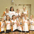Group photo of people in white shirts with text overlays on pink and orange backgrounds.