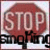 A static pixelated image shows a red octagonal stop sign with white text reading 'STOP' above partially obscured black text on a light background.