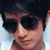 A person with dark hair and sunglasses appears in three views showing slight head position shifts against a light background.