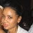 A person with dark hair in a white top appears across four showing slight head and eye position changes