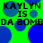 Green background with blue circles and repeated black text reading "KAYLYN IS DA BOMBDA BOMB" in a pixelated style.