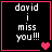 Black background with white pixelated text reading 'david i miss you!!!' and pink heart symbols in four