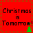 Red background with green dotted border, black text reading "Christmas is Tomorrow!" and a small green Christmas tree icon.