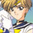 Pixelated anime-style character with light brown hair, blue eyes, and a white top with dark trim against a pale blue background.