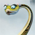 Pixelated cartoon snake head with large blue eyes and a yellow-green face, body curving right against light gray background.