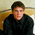 A pixelated image of a person in dark clothing against a light background, with green text reading 'Original Icons .com' on the right side.