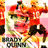 Pixelated image of a character in red outfit with green accents, dynamic pose, and visible text at bottom.