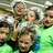 Pixelated group photo of people in green shirts with text overlays reading 'niles elites ladies' and 'don't u wish u were i?' on black backgrounds.