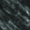 Animated sequence showing diagonal streaks of light against dark and green backgrounds with shifting brightness and color tones.