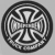 Circular black-and-white pixelated icon featuring a stylized cross with four curved arms inside a double-lined border.
