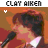 Clay Aiken singing into a microphone with changing head positions across three of frames