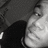 A grayscale pixelated image shows a partial figure with dark and light areas, no visible text or distinct features.