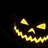 Animated pumpkin face with glowing yellow eyes and jagged mouth, white 'BOO' text above on black background.
