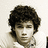 A pixelated image of a person with curly hair on the left, next to yellow text reading 'i LOVE nick jonas' on black background.