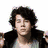 Two individuals with distinct hairstyles and clothing appear in a split- layout above text reading 'love these boys.'
