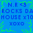 Blue background with green pixelated border, repeating text 'N.R <3', 'ROCKS DA', 'HOUSE x10', 'XOXO' in blue pixelated font.