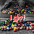 Animated sequence of red text on a pixelated background with colorful scattered dots, displaying phrases about Skittles and a rainbow.