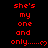 Red pixelated text on black background reads "she's my one and only......" with a small heart symbol, repeated in multiple