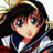 Pixelated anime-style character icon with dark hair, large eyes, and a school uniform-like outfit against a blurred background.