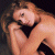 A pixelated image of a woman with long brown hair resting her head on folded arms against a dark background, next to green text reading "Original Icons .com".
