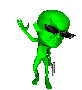 Green cartoon alien with black sunglasses, holding a small silver object in one hand and making various gestures
