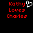 Red pixelated text reads 'Kathy Loves Charles' with a white heart symbol replacing the letter O in 'Loves', displayed on black background.