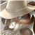 Pixelated static image of a character with light brown fur, dark brown ears, and a white underbelly, partially obscured by low resolution.