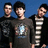 Three individuals stand side-by-side against a blue background, with pink pixelated text reading "I love the Jonas brothers" on the right.