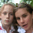 Two women in white and red clothing appear in a with text overlays changing across frames
