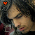 A pixelated image of a person with dark hair and closed eyes, wearing a red and white striped shirt, with an orange heart symbol in the top-left corner.
