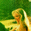 Pixelated angel figure with blonde hair and yellow wings against green background, showing slight head movement