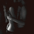 Animated grayscale icon shows a stylized figure with raised arm and curved body against dark background, transitioning from left to right.