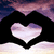 A heart-shaped cutout reveals a sky background with purple and pink clouds, framed by black hands forming the shape.