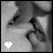A black-and-white animated contact sheet showing two frames of a kissing couple with heart symbols changing from white to black between frames.