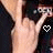 Pixelated image of a person in dark clothing with raised arms, showing two heart symbols and "ROCK ON" text at the bottom.