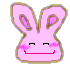 Pink bunny head with closed eyes, pink blush marks on cheeks, and a red curved mouth against gray background.