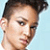 A pixelated image of a person with short dark hair against light blue background, featuring text and heart symbol.