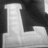 Black-and-white image of large blocky letters 'LBS' and 'U', with orange pixelated text reading '(COLLEGE) CHIC!' on a black background.